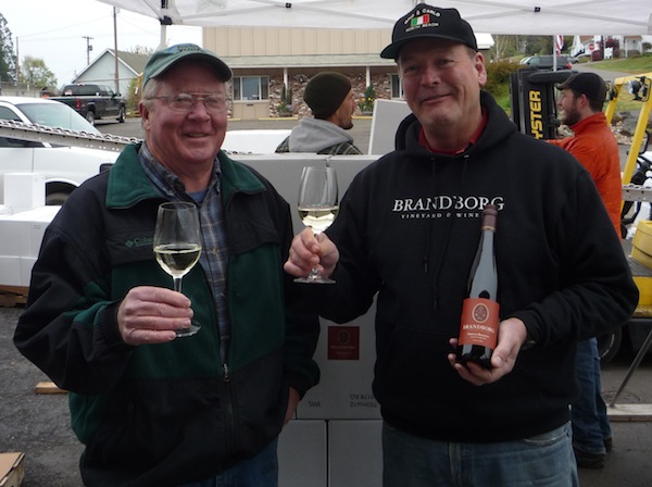 John Bradley, left, and Terry Brandborg toast the first commercial bottling of wine — Riesling harvested in 2012 — from the newly established Elkton American Viticultural Area. Brandborg used Bradley Vineyard fruit for the historic wine.