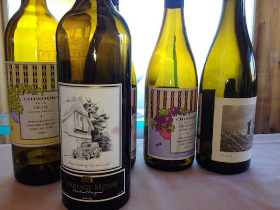 Cote Bonneville's Carriage House, which is made by Kerry Shiels from her family's DuBrul Vineyard, stands alongside wines by Chinook and Owen Roe during Monday's trade luncheon by Wine Yakima Valley.