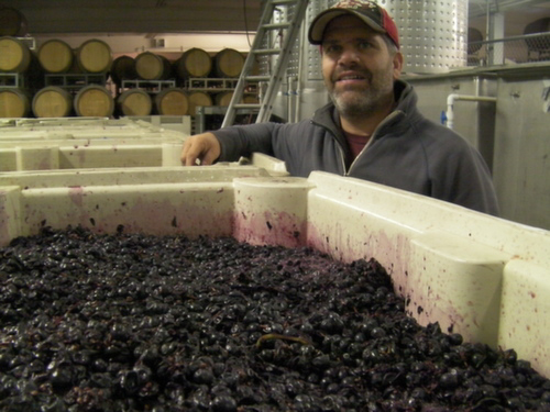 Robert Smasne checks on fermentations Oct. 1, 2013 at his winemaking warehouse in Grandview, Wash.