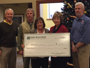 The 2014 Barrel Full of Money campaign generated $11,408 for the Blue Mountain Action Council. Making the presentation, left to right, are Duane Wollmuth, Walla Walla Valley Wine Alliance; Jeff Mathias, Blue Mountain Action Council; Kathy Covey, Blue Mountain Action Council; Megan Clubb, Baker Boyer Bank; and Scott Peters, Columbia REA.