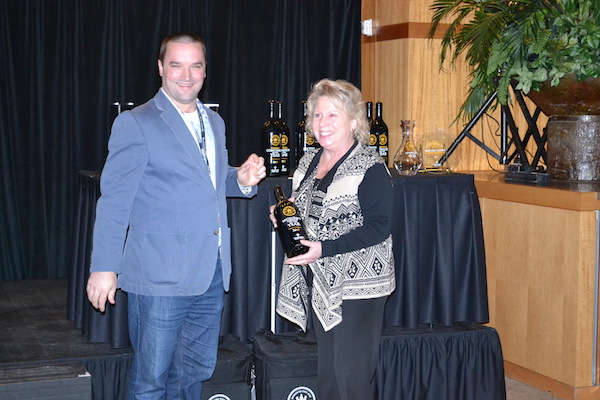 Lane Hoss of Anthony's Restaurants, receives the Restaurant Group of the Year award from Chris Stone and the Washington State Wine Commission on Jan. 27, 2015, in Seattle.