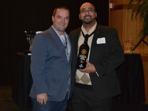 Yashar Shayan of ImpulseWine.com receives the Independent Retailer of the Year from Chris Stone and the Washington State Wine Commission on Jan. 27, 2015, in Seattle.