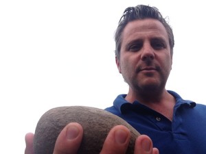 Christophe Baron of Cayuse Vineyards holds a cobblestone from his vineyard in the Walla Walla Valley.
