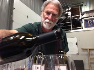 Master of Wine Bob Betz pours wine at Betz Family Winery in Woodinville, Washington.