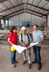 Naumes, Inc., plans to open its new Naumes Crush and Fermentation facility in Medford, Ore., on Aug. 1. Laura Naumes, goes over plans with project manager Kyle White, center, and winemaker Chris Graves.