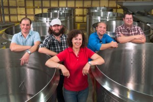 Laura Naumes, CEO of Naumes Crush and Fermentation, is flanked by, left to right, winemaker Chris Graves, Joe Naumes, Elliott Anderson and Sean Naumes. (Photo courtesy of Naumes, Inc.)