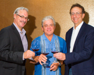 Panther Creek Cellars winemaker Tony Rynders, Panther Creek Cellars founding winemaker Ken Wright, and Sam Bronfman, co-founder and managing partner of Bacchus Capital Management, raise a toast on July 13 in Portland during a trade luncheon at Imperial Hotel.