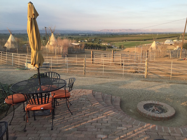 The corral and the teepees are quiet as the sun rises over the Yakima Valley and Cherry Wood Bed Breakfast and Barn in Zillah, Wash.
