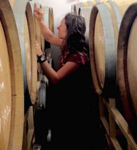Meredith Bell, co-winemaker/co-owner of Statera Cellars, charts the progress of her Chardonnay barrels at Omera Cellars in Newberg, Ore.