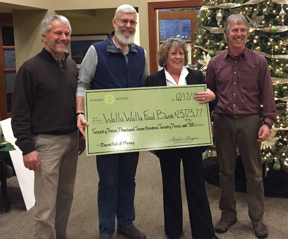 The 2015 Barrel Full of Money campaign generated $23,723 for the Blue Mountain Action Council’s Walla Walla Food Bank. Making the presentation, left to right, are Duane Wollmuth, Walla Walla Valley Wine Alliance; Scott Peters, Columbia REA and Blue Mountain Action Council members Kathy Covey and Jeff Mathias,