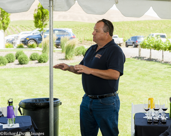 Robert Thompson, owner of Vintners Logistics in Kennewick, Wash., addresses winemakers during annual Quintessence Vineyards tasting on Washington's Red Mountain.