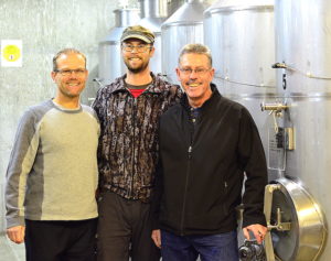 Roland Kruger, left, winemaker Nicholas Kruger, and managing winemaker Hagen Kruger stand out for their work in the cellar, which is under the tasting room at Wild Goose Vineyards in Okanagan Falls, British Columbia.